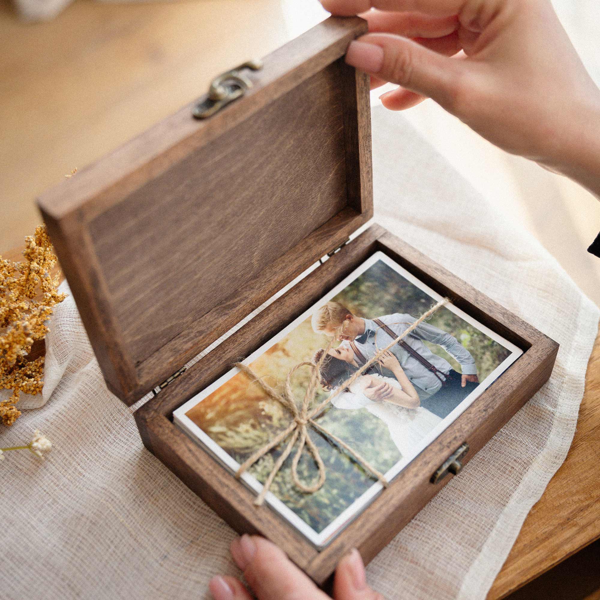 Open Walnut Classic wooden photo box with prints tied with linen twine