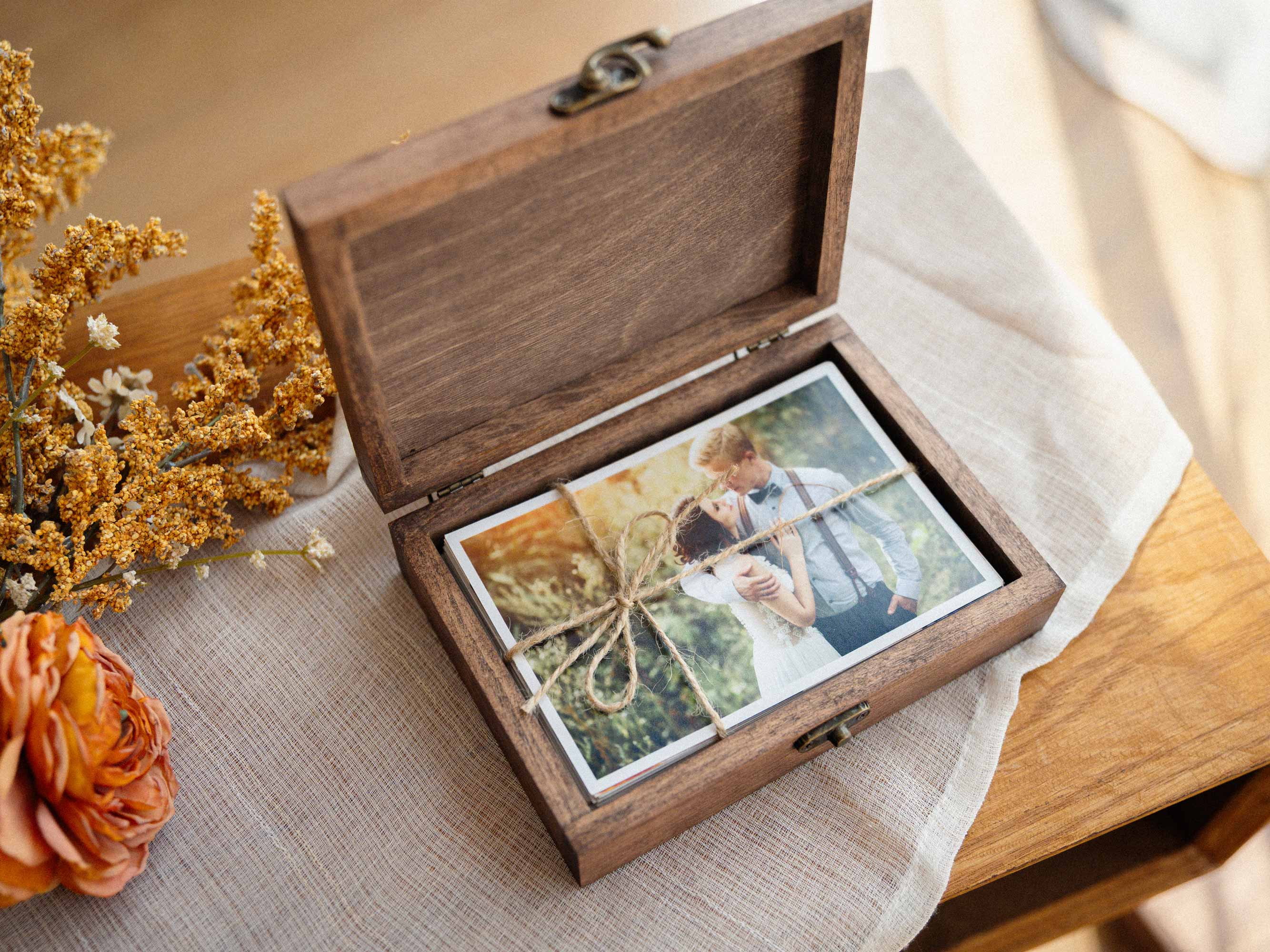 Open Walnut Classic photo box with wedding prints and hinged wooden lid