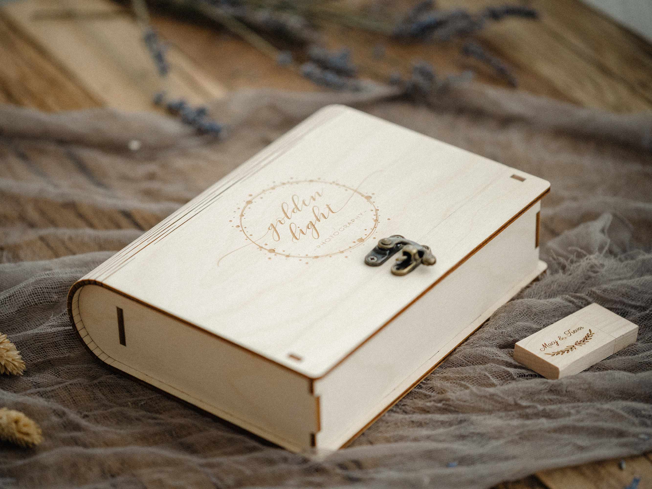 Handmade maple wooden photo box with vintage hook and matching wooden USB on soft fabric